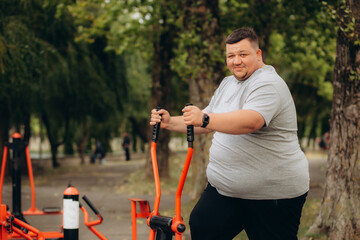 a fat man loses weight on an exercise bike