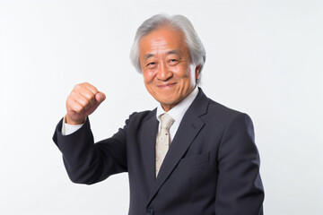 a man in a suit and tie is raising his fist