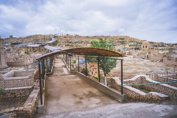 Fototapeta premium Ancient Muslim cemetery Mizdakhan with a centuries-old history on a hill in Uzbekistan with mausoleums and burials necropolis