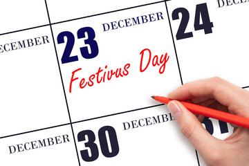 December 23. Hand writing text Festivus Day on calendar date. Save the date. Holiday. Day of the...