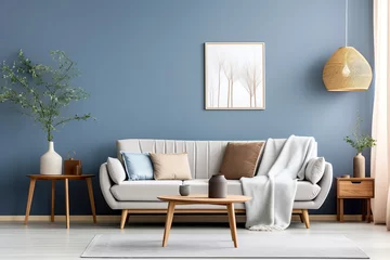 Foto op Canvas Round coffee table, side cabinet near grey sofa against blue wall. Scandinavian home interior design of modern living room. © Vadim Andrushchenko