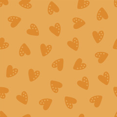 Seamless pattern with brown hearts