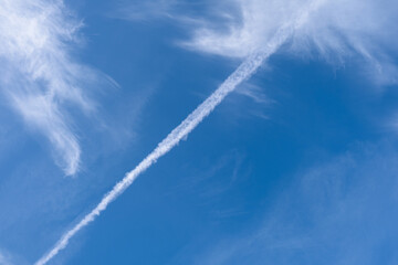 Fototapeta na wymiar Chemtrail Patterns on Blue Sky