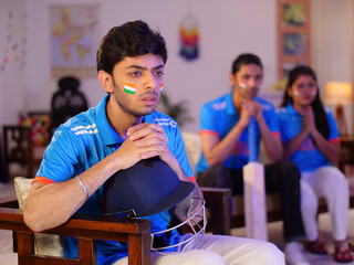 Cricket fans watching a live match at home - Praying for the victory of an Indian cricket team ...