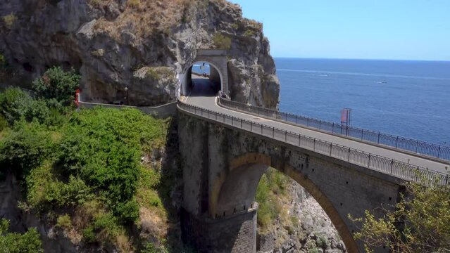 famous picturesque road viaduct of Amalfi summer coast with sea water, Italy, web banner format