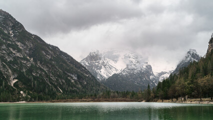 Fototapeta na wymiar Panoramic view of Braies lake, Alps, Italy. Copy space calm background. Mental health concept.