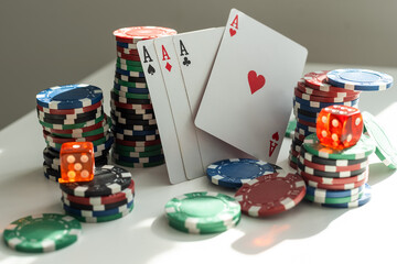 Gambling chips and spades isolated on white