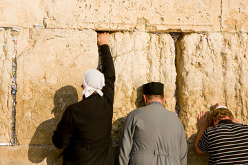 Praying Jewish people, traditional Orthodox Jews, in front of the Wester Wall, Wailing Wall,...