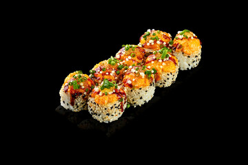 Set of baked sushi roll with shrimp and salmon on a black background. Japanese food, photo for menu