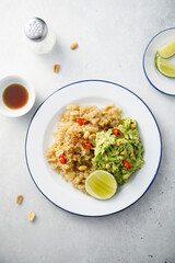 Healthy quinoa with mashed avocado