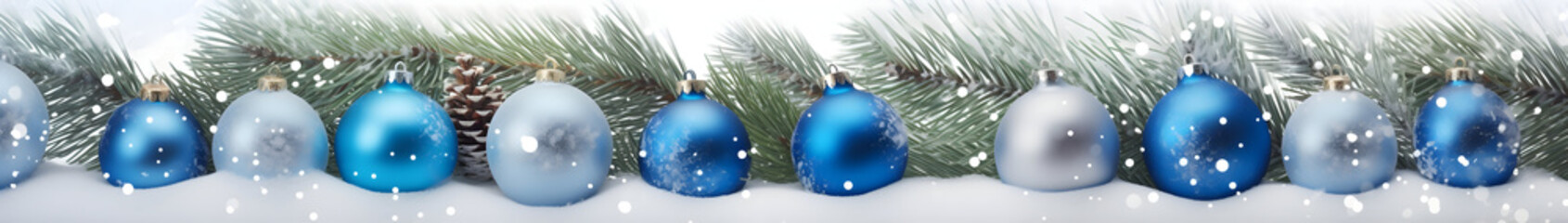 Blue Christmas balls in a row with spruce branches covered with snow and snowfall on white...