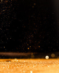 Sparkling Defocused Orange Lights Over Dark Background. Christmas Gold Lights Background with Copy Space