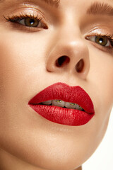 Naklejka premium Cropped photo of beautiful woman with bright fashion make-up. Red lip matte lipstick. Female full plump sexy lips.