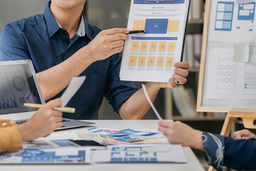 Creative team web designer planning application development for web mobile phone with customer...
