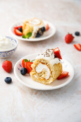 Homemade Swiss roll with whipped cream and berries