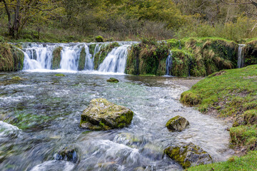 The Restored Calver Weir, built in the 19th century to provide water to power cotton spinning at Calver Mill, on the River Derwent, in the Peak District National Park, Derbyshire