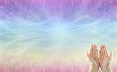 Channeling high resonance healing energy - open palm hands  against a multicoloured energy field...