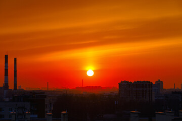 Fototapeta premium Red sunset over the city. Cityscape at dusk.
