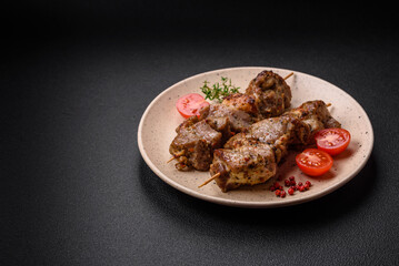 Delicious fried shish kebab of chicken or pork meat with salt, spices and herbs