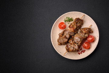 Delicious fried shish kebab of chicken or pork meat with salt, spices and herbs