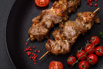 Delicious fried shish kebab of chicken or pork meat with salt, spices and herbs