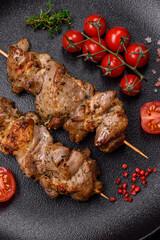Delicious fried shish kebab of chicken or pork meat with salt, spices and herbs