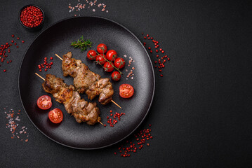 Delicious fried shish kebab of chicken or pork meat with salt, spices and herbs