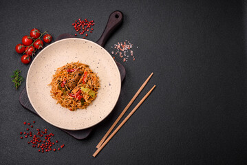 Delicious udon noodles with meat or seafood, vegetables, salt and spices