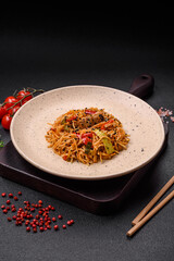 Delicious udon noodles with meat or seafood, vegetables, salt and spices