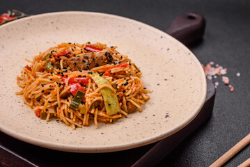 Delicious udon noodles with meat or seafood, vegetables, salt and spices