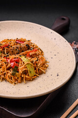 Delicious udon noodles with meat or seafood, vegetables, salt and spices