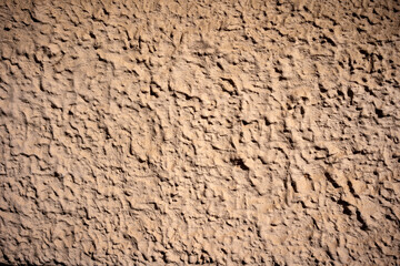 Beige background. Textured Plaster of the wall.