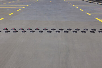 Speed Bumps On The Road In A Parking Lot