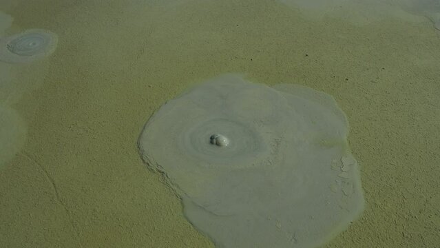 Mud volcano, mud dome is a landform created by the eruption of mud or slurries, water and gases. Several geological processes. Air or gas bubbles burst on the surface of the therapeutic clay. Temryuk.