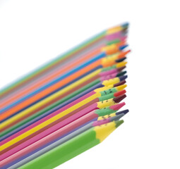 Rainbow colored wooden pencils with faces have many emotions