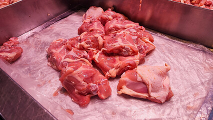 Raw chicken thighs in super market 