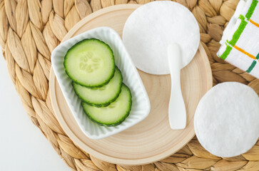 Cucumber slices for preparing homemade face toner or beauty mask. Natural beauty treatment and spa recipe. Top view.