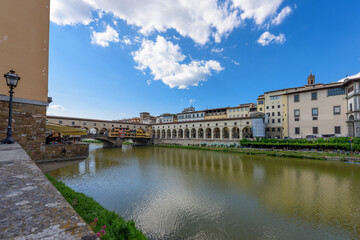 Florence, Italy - June 28, 2023: Florence, Italy on the Arno River. View of Ponte Vecchio bridge.