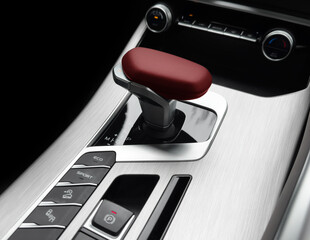 Automatic gear stick of a modern car. Modern car interior details. Close up view. Car inside. Automatic transmission lever shift. Black leather interior with stitching