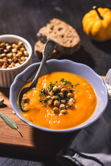 Homemade pumpkin soup with crispy roasted chickpeas	 - 675252407