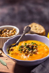 Homemade pumpkin soup with crispy roasted chickpeas	 - 675252409
