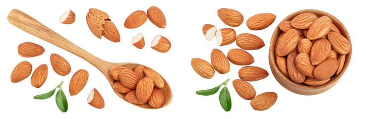 Almonds nuts with leaves in wooden spoon isolated on white background with full depth of field. Top view. Flat lay.