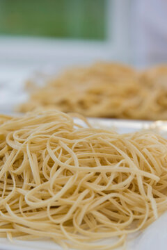 Two heaps of freshly made pasta
