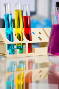 Test tubes and flask with colorful fluids
