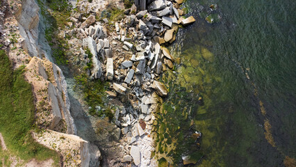 aerial top view of coastline along the sea with limestone cliff