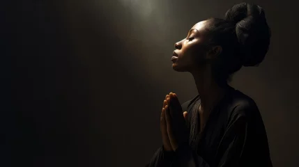 Foto op Plexiglas Spiritual black woman in prayer. The concept of deep faith © BraveSpirit