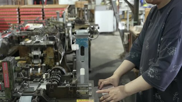 A mechanized line for the production of matches, where the blanks are sorted and the composition of the match head is skillfully applied to obtain a stable result.