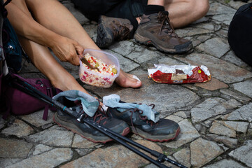 Pilgrims from the Camino de Santiago arrive at the Plaza del Obradoiro because they have finished...