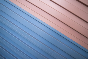 Colored corrugated metal sheet texture with diagonal stripes for roofing, background for text