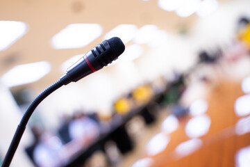 Close-up shot of microphone in conference room on bokeh light background